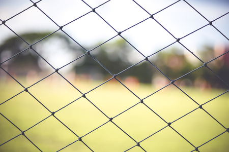 boys kicking football on the sports field,abtract blurの写真素材