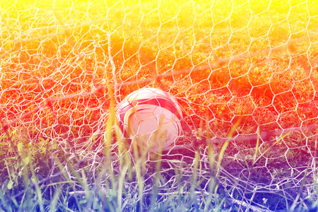 boys kicking football on the sports field,abtract blurの写真素材