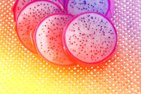 Fresh pitahaya cut on Wood weave basket backgroundの写真素材