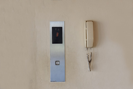 Press the elevator and elevator emergency phone.の写真素材
