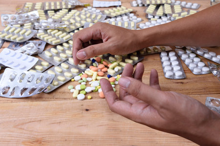 hand and capsules of medicines