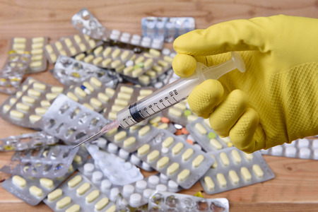 syringe and capsules of medicinesの写真素材