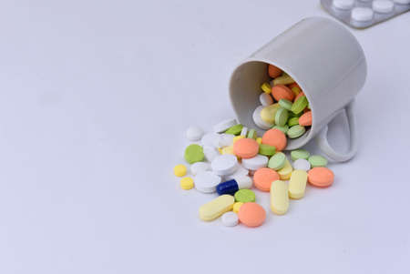 Many pills isolated on white backgroundの写真素材