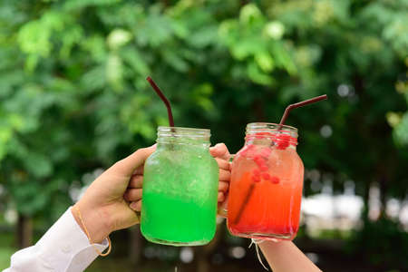 Green juice with ice in a jar.の写真素材
