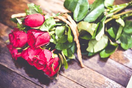 Red roses on wood background, Valentines Day background, wedding dayの写真素材