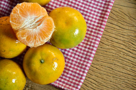 Fresh Orange on Wood Backgroundの写真素材