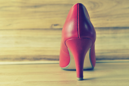 Red women shoes on wooden background,Vintage Styleの写真素材