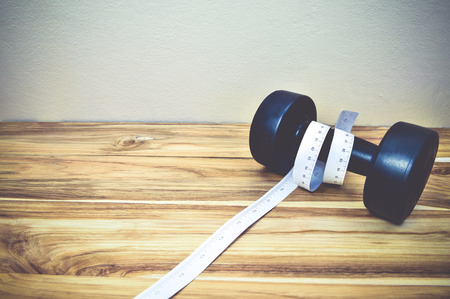 dumbell on wood backgroundの写真素材