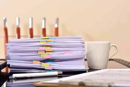 Office workplace with documents on office deskの写真素材