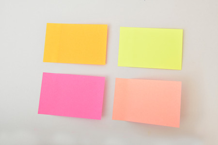 The paper notes stuck on the computer on the desk.の写真素材