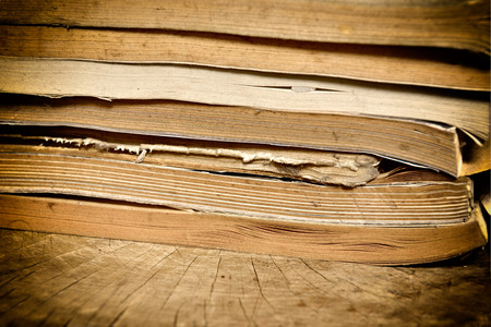 old book on wood backgroundの写真素材