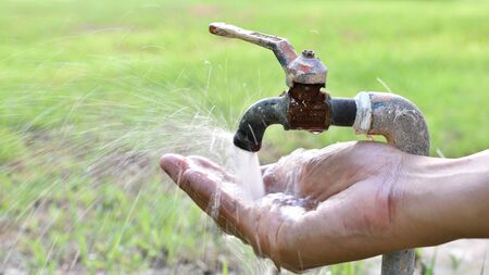 Help conserve water by turning off the tap water after use.の写真素材