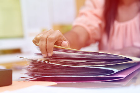 Female employees are handling the file.