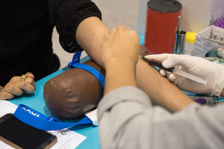 Syringe in the hands for taking a blood sample from patient.