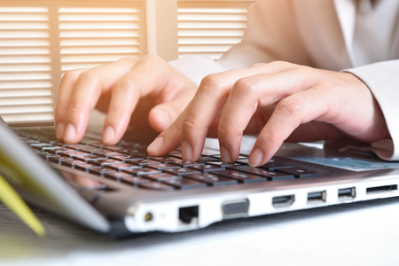 Data entry,Women key information into the computer.の写真素材