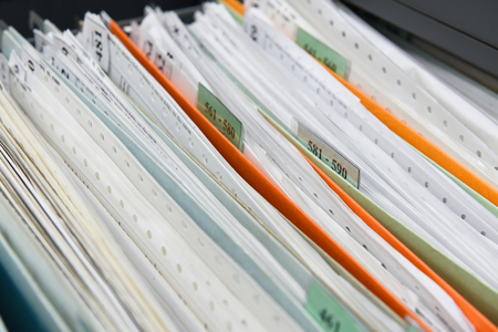 file folders with personal finance documentsの写真素材
