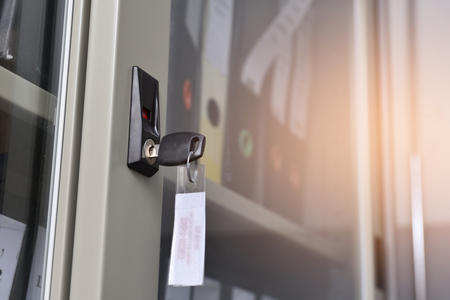 Key to unlock the file cabinet to store the data file.の写真素材