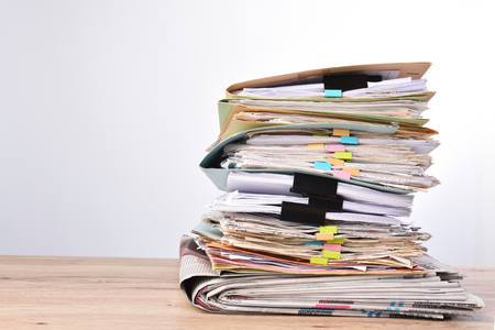 Stack documents pace on wood desk in officeの写真素材