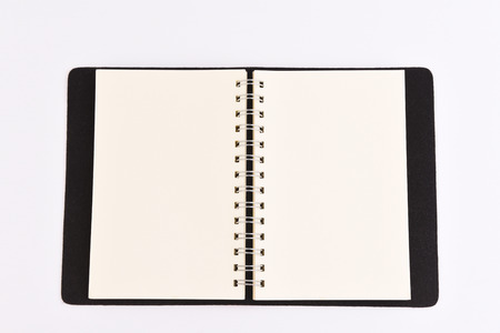 The notebook is open for writing notes on isolated background.の写真素材