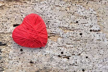 Valentine day,Red heart on old wood use for backgroundの写真素材