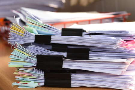 Stack Document file and black PaperClip pace on Cabinet in office.の写真素材