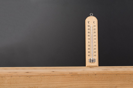 Thermometers are used for measuring the temperature on the wooden floor.の写真素材