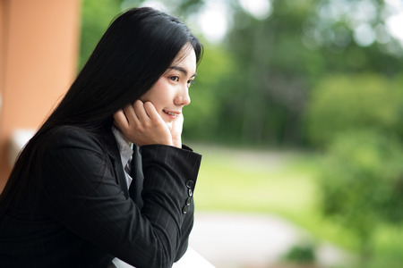 Portrait of a woman working in a black suitの写真素材