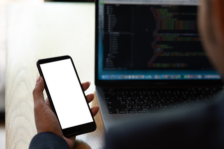 Businessmen hold the phone to check email on the internet.の写真素材