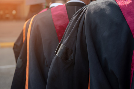 Graduates wear graduation gowns,Ceremonies of university graduates.の写真素材