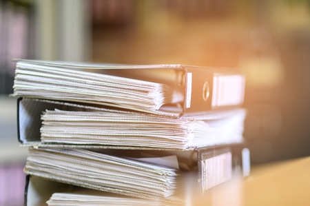 Stacked black documents at the officeの写真素材