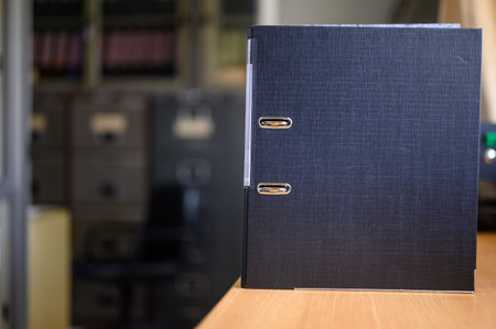 Documents waiting to be approved, placed at the office desk
