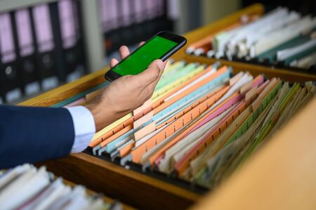 Employees are managing documents at the office.の写真素材