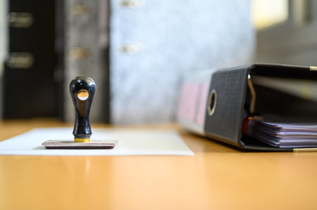 Documents waiting to be approved, placed at the office desk