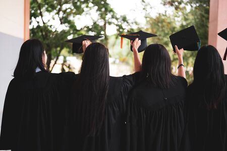 The graduating student group wore a black hat, black hat, at the graduation ceremony at the university.の写真素材