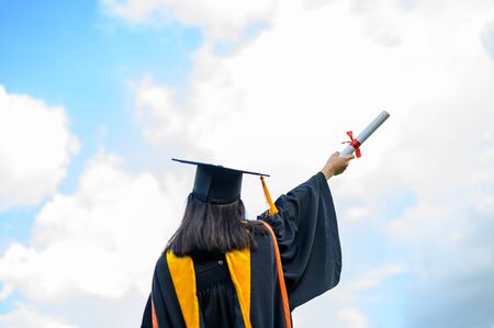 A young female student graduating from universityの写真素材
