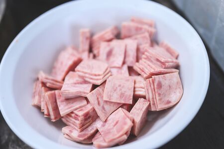 Square sliced pork slices placed in a plateの写真素材
