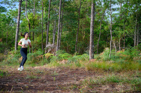 A woman running trek at a mountain pine forest.