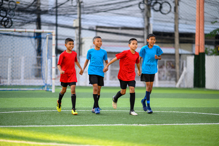 Boys playing football on the football practice fieldのeditorial素材