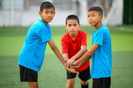 Boys playing football on the football practice fieldのeditorial素材