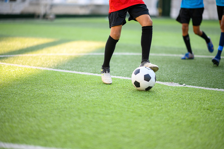 Boys playing football on the football practice fieldのeditorial素材