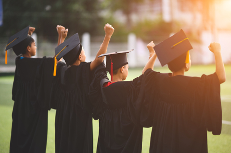 A group of boys are happy on their graduation day at school.のeditorial素材