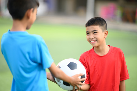 Boys playing football on the football practice fieldのeditorial素材