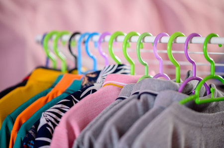 Clothes hanging on clothes hangers in the dressing room