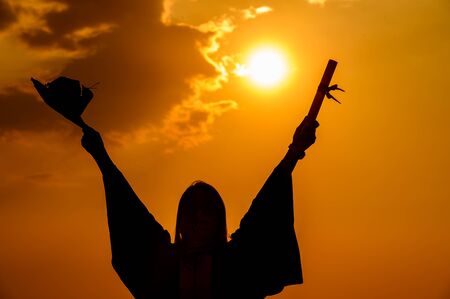 abstract Close up Rear view of the university graduates at Silhouette sunsetの写真素材