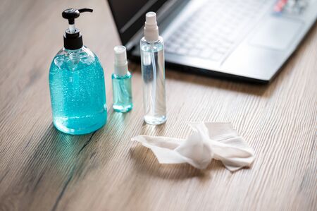People are working at home because of the epidemic and there is alcohol for cleaning.の写真素材
