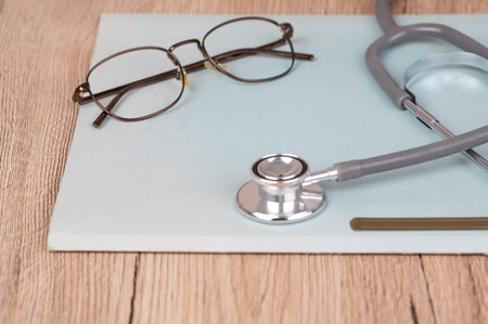 The stethoscope is on the desk at the diagnosis clinic.