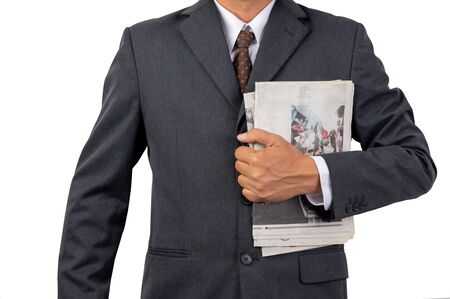 A businessman holding a newspaper on isolated background and clipping pathの写真素材