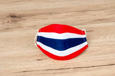 Health mask made from Thai flag fabric on the desk.の写真素材