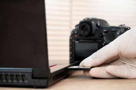 Close up delivery man holding a delivery box packageの写真素材