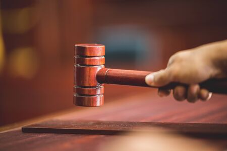 Judge held Wooden Hammer for Adjudge Judicial of Lawyer In the courtroomの写真素材